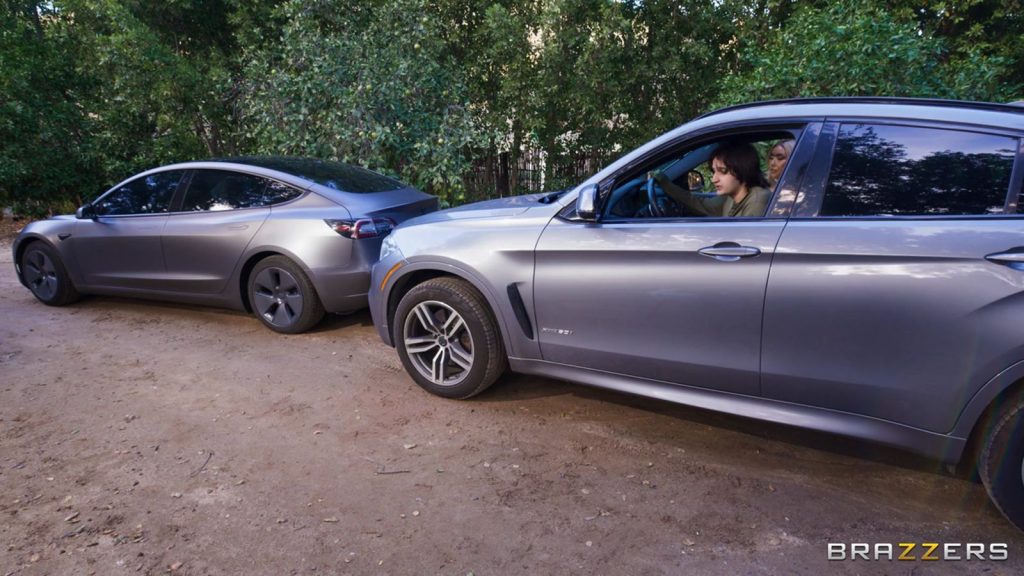 Far away view of two cars in a fender bender