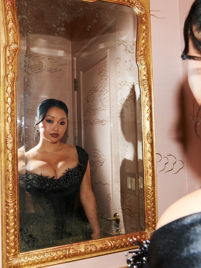 Close up in a fancy mirror of Asian woman looking at her own reflection