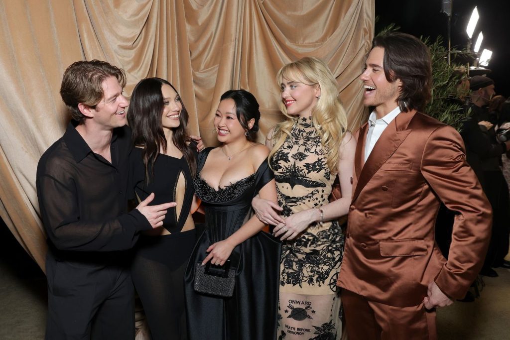 Cropped frontal of two men and two women having a laugh at an event