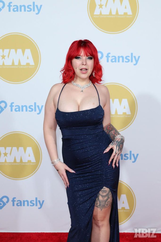 Closer frontal of porn star in sexy dress on the red carpet