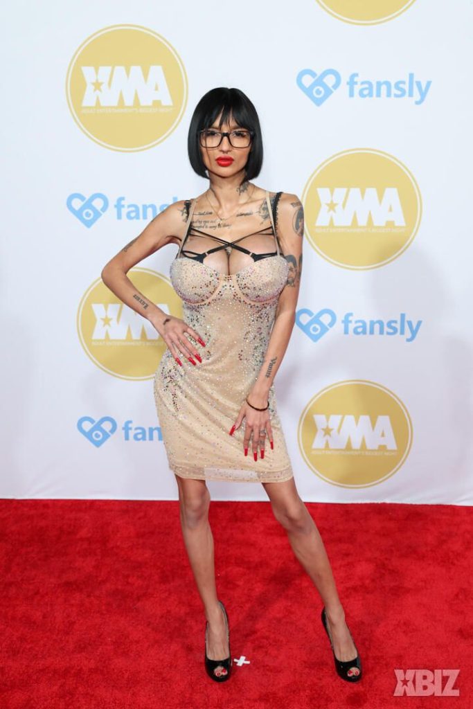 Frontal of porn star in sexy dress on the red carpet