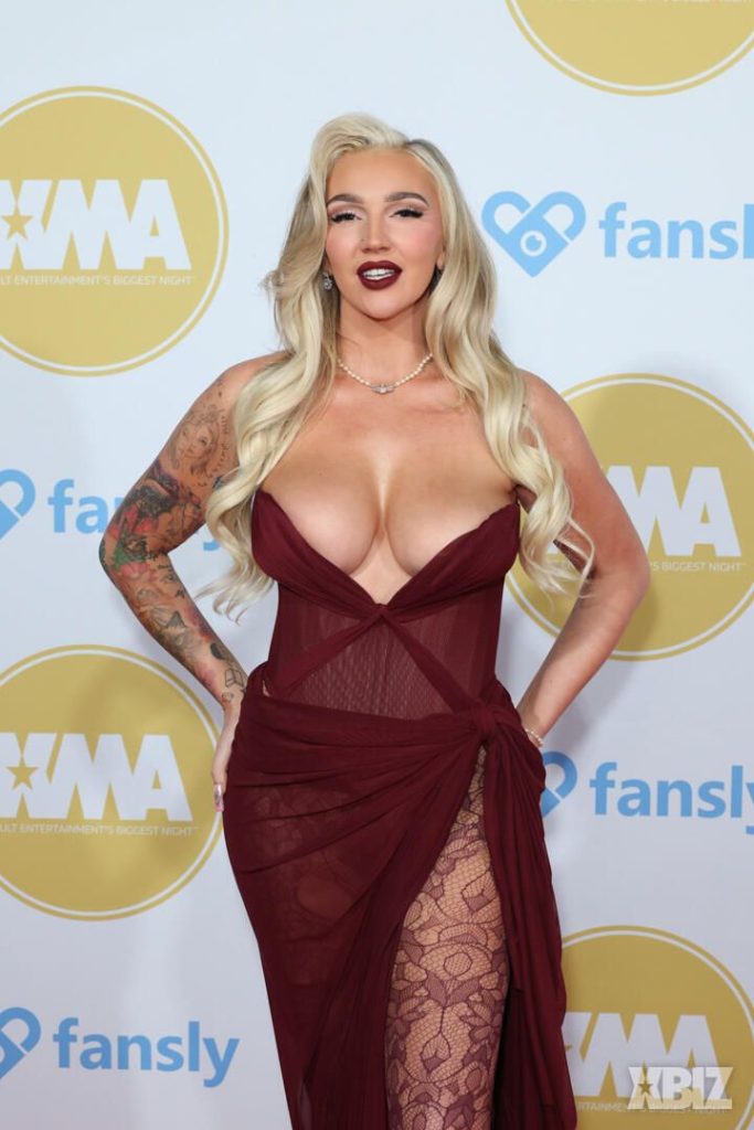 Closer frontal of porn star in sexy dress on the red carpet