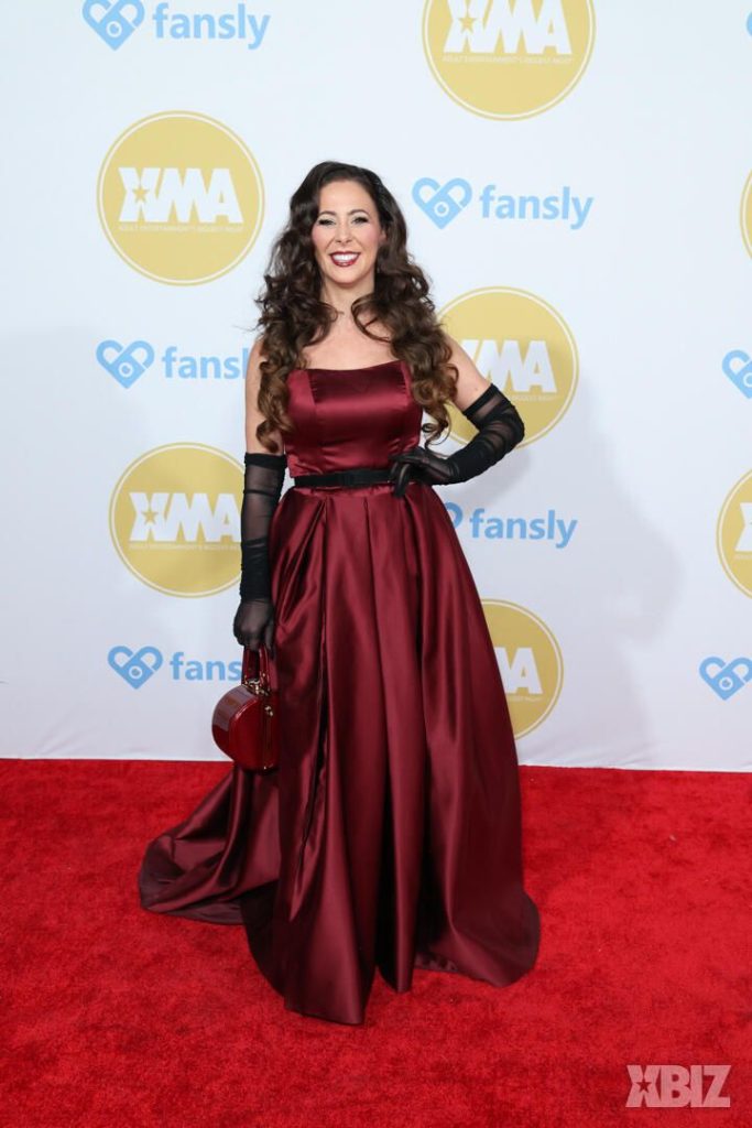 Frontal of porn star in a fancy dress on the red carpet