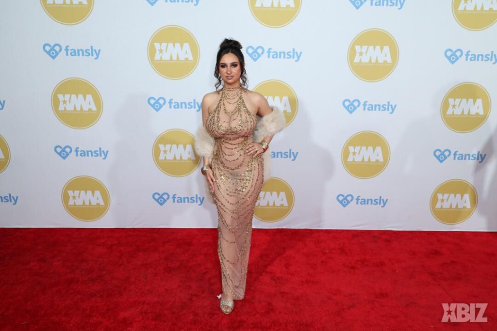 Frontal of porn star in sexy dress on the red carpet