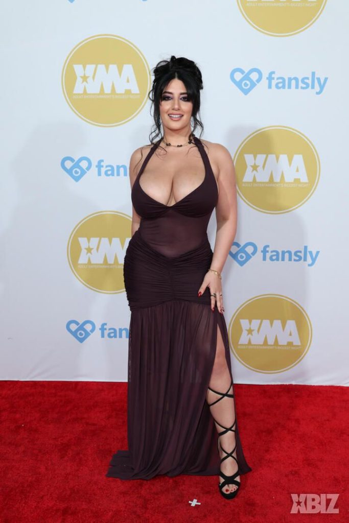 Frontal of porn star in sexy dress on the red carpet