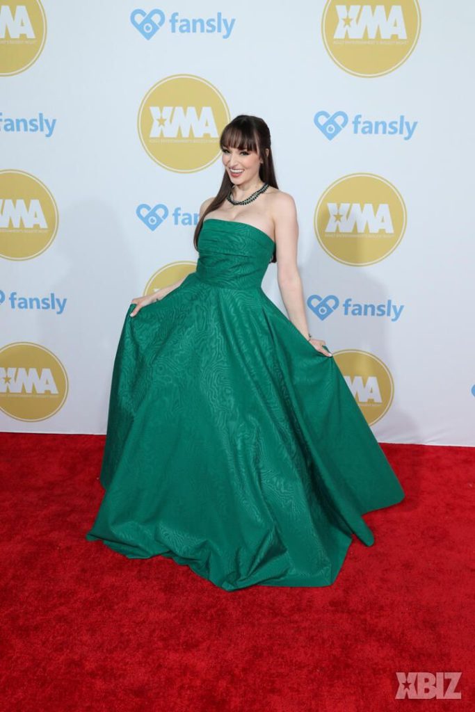 Frontal of porn star in fancy dress on the red carpet