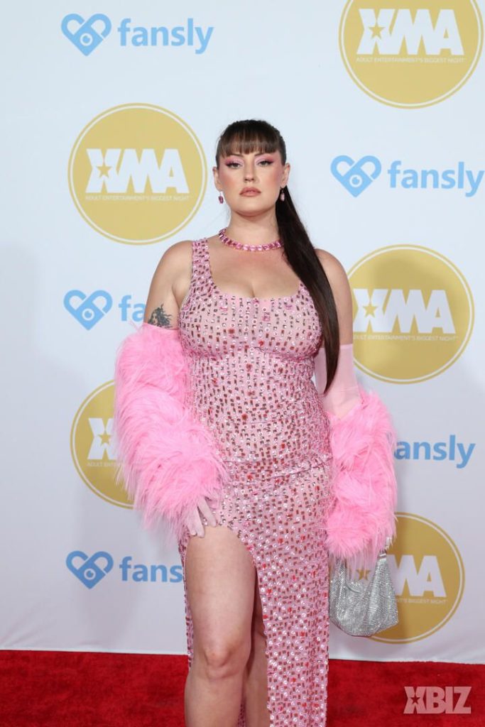 Closer frontal of porn star in sexy dress on the red carpet