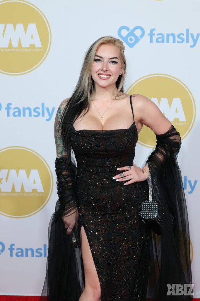 Closer frontal of porn star in sexy dress on the red carpet