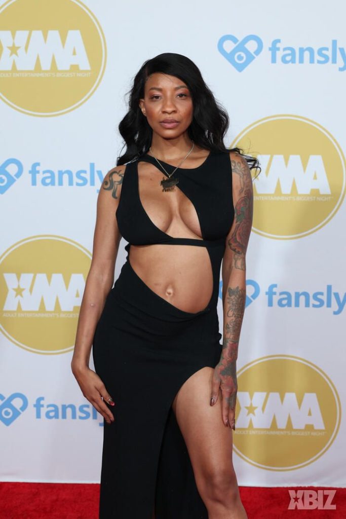 Closer frontal of porn star in sexy dress on the red carpet