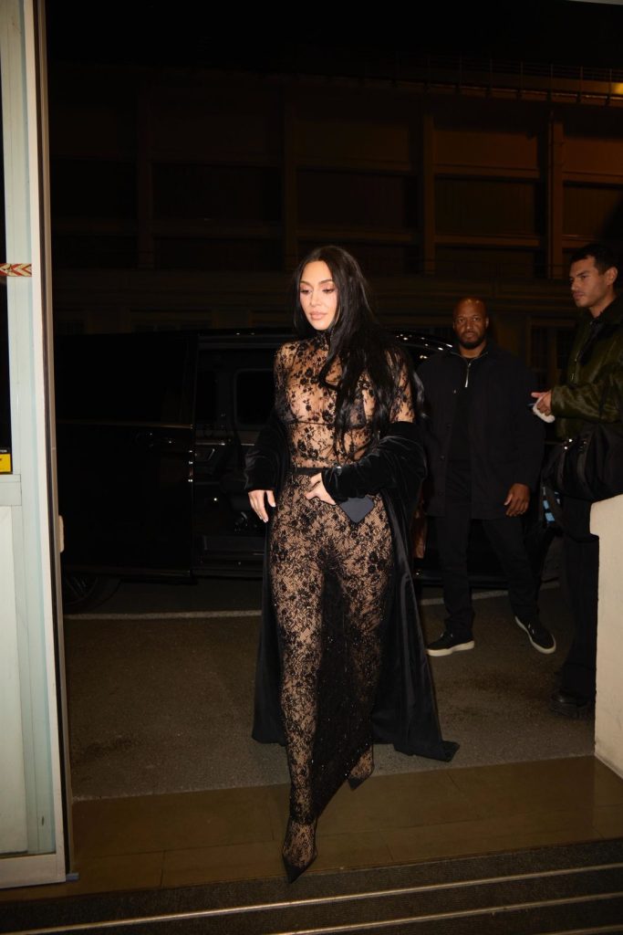 Frontal view of Kim Kardashian entering a building