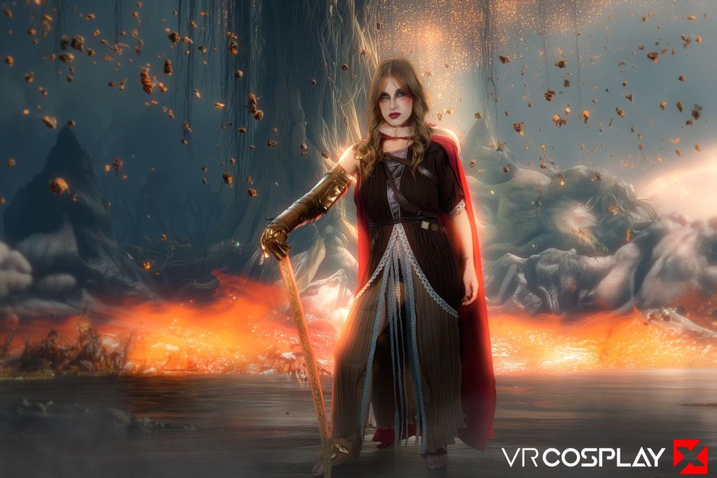 A woman in a fantasy warrior costume with a golden arm guard, sword, and red cape stands in a mystical landscape with glowing orange light, floating debris, and a dramatic background.