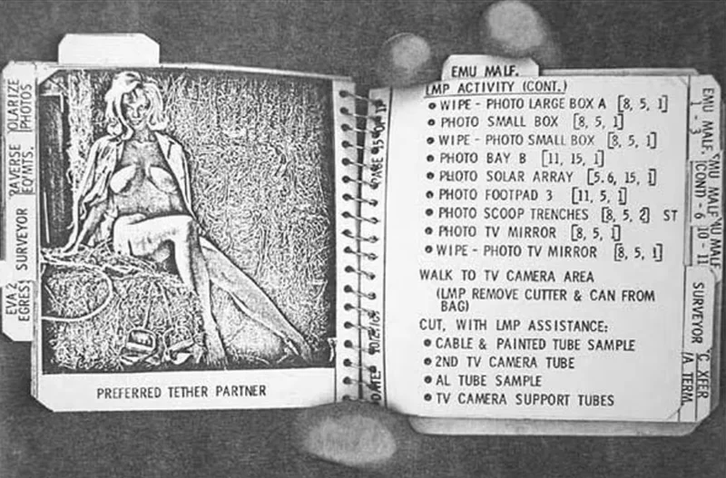A black-and-white photo of an open notebook; the left page shows a sketch of a woman labeled Preferred Tether Partner, and the right page has a checklist of tasks and photography notes related to lunar activities.