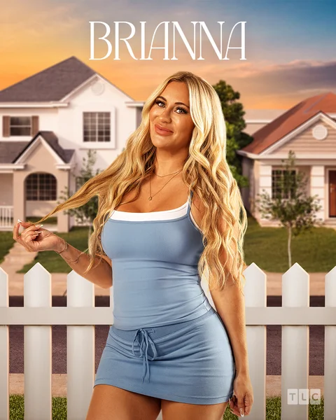 A woman with long blonde hair in a light blue dress stands smiling in front of a white picket fence, with houses and a sunset sky in the background. Text above her reads BRIANNA..